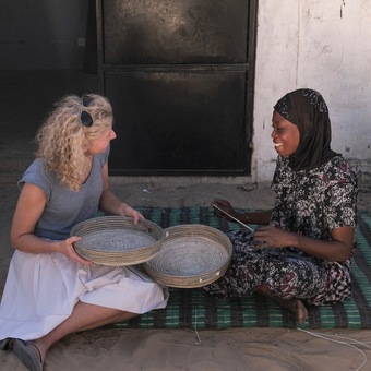 Elizabeth discussing designs with one of the weavers