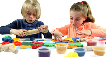 Children playing with play dough