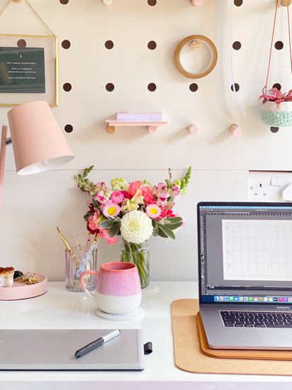 Office workspace with aesthetic pink accessories