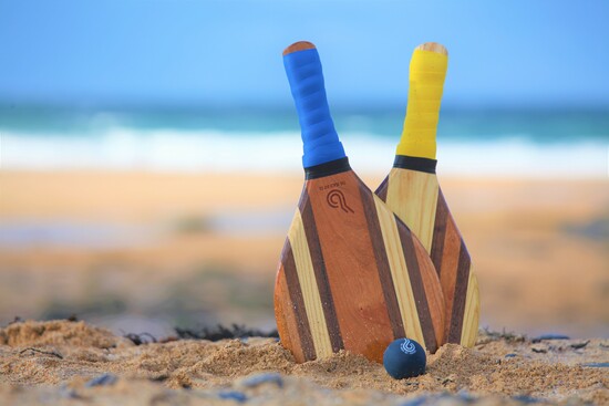 Beach bats and ball, beach games, beach racquet, beach paddle.