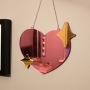 Pink and gold heart shaped wall mirror