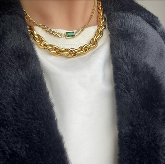 Layering chunky gold chains with gemstones