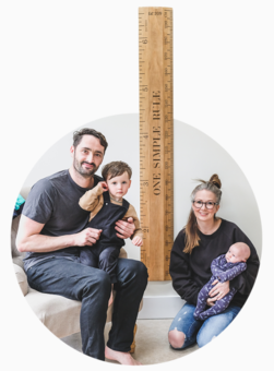 The Dobson family with a height chart ruler