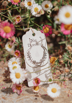 Silver moon 'Selene' Earrings from our Gossamer collection, nestled among pink and white aster daisies and dried petals.