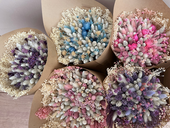 Dried flower bouquets including blue dried flowers, pink dried flowers, purple dried flowers