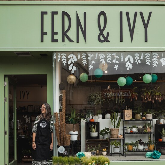 Brand founder, Kate, standing in the doorway of the Fern & Ivy store in Cirencester