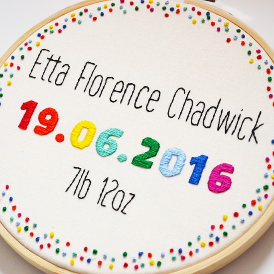 a personalised birth announcement embroidery in rainbow colours