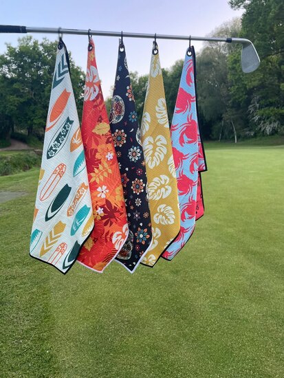 Golf towels on golf club. 