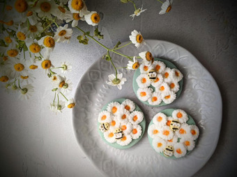 Plate of our hand iced daisy biscuits 