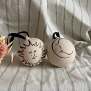Hand painted ceramic baubles with sun and moon illustrations
