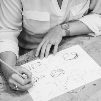Emma-Kate hand sketching designs of bespoke jewellery