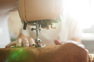 Once the leather pieces have been cut from our unique patterns, the pieces are glued and machine stitched into place.