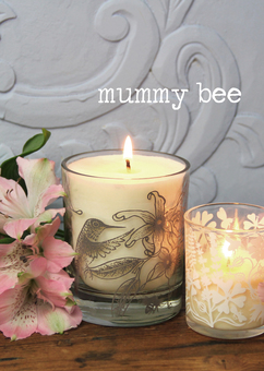 Natural wax candles in printed glassware