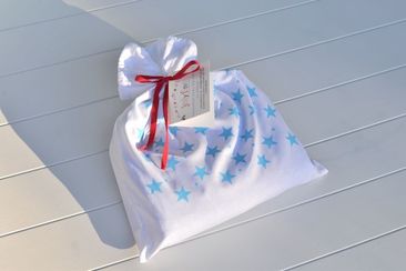 Gift wrap using fun star print fabric bag and hand written gift note