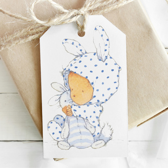 Little baby watercolour illustration on a gift tag to match wrapping paper