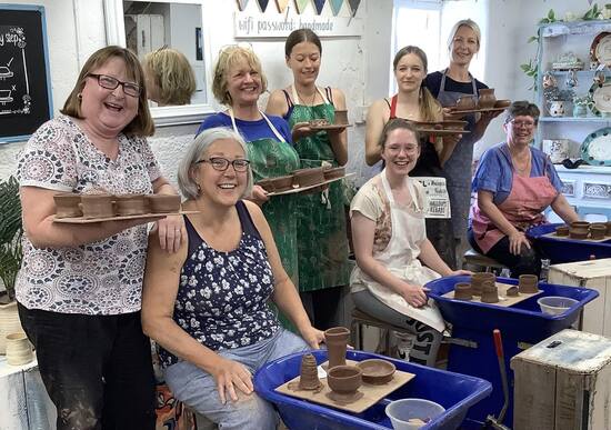 participants on a day potter's wheel course at eastnor pottery and the flying potter