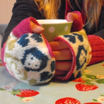 Knitted lambswool Russian doll hand warmers 