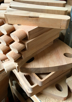 Machined pieces of solid oak pile up in the workshop during production of our personalised wooden gifts and furniture