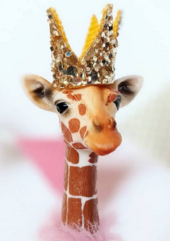 Party animal giraffe wearing a gold sparkle crown.