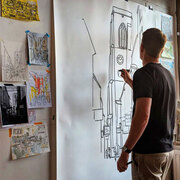 Drawing a large scale mural during an exhibition