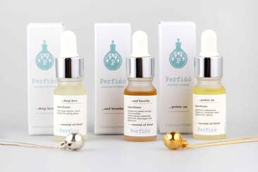 three perfino essential oil blends with pendants in silver and gold