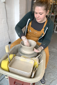 Fi from FICH ceramics throwing on the potter's wheel