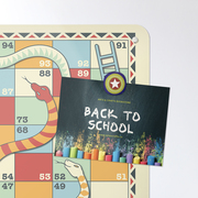 A millefiori design fridge magnet on a Snakes and Ladders game magnetic notice board