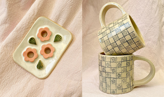 Floral soap dish on a pink backround. Two mugs stacked with a pencil floral pattern.