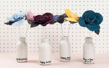 Fabric flowers in personalised ceramic bottles