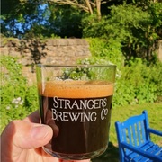 Stout in a Strangers Signature glass on a sunny day