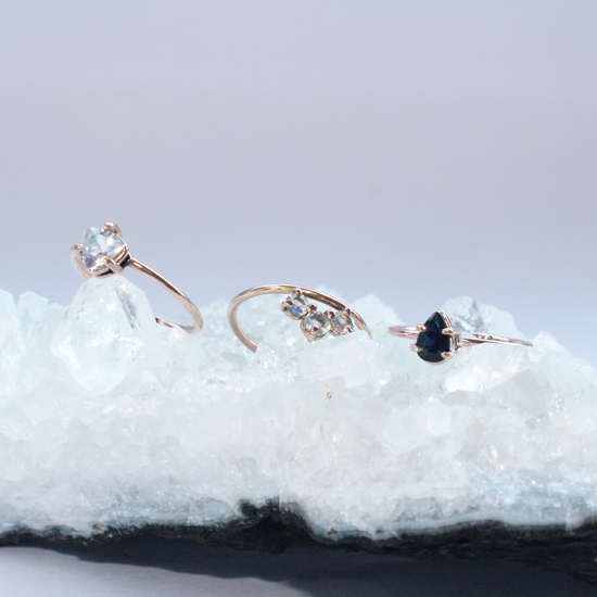 Collection of rose gold rings featuring precious gemstones