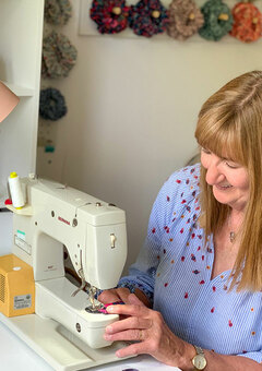 Kate at sewing machine