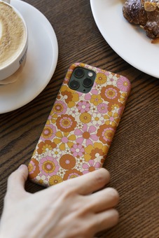 70s phone case with coffee and croissant