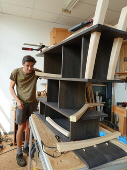 Roland assembling a cabinet.