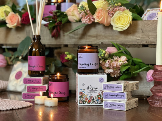 a collection of The Flora Lab products including candles, wax melts and diffusers 