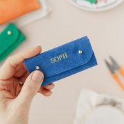 Personalised sewing needle case in cobalt suede.