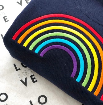 Dreamer design features a lovingly embroidered rainbow motif on the reverse and the word Dreamer on the front in our signature rainbow text.