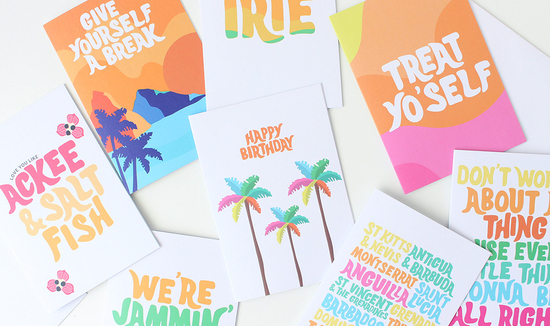 Image of a collection of bright colourful greeting cards laid on a white table