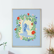 image of a botancial art print featuring a woman and floral drawings.