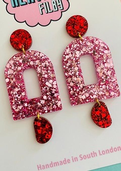 Photograph of pink and red glitter geometric earrings