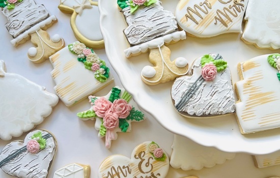 Image of iced biscuits in a wedding theme with flowers