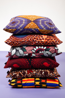 colourful african print cushions covers in kente, pink, red, orange and purple prints