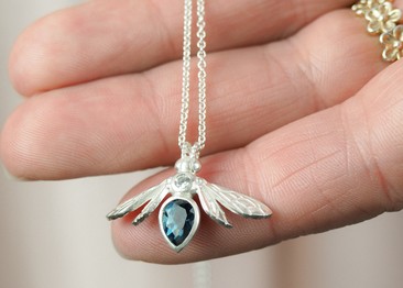 gemstone bee necklace with london blue topaz