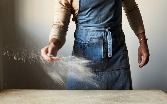 Matt Adlard dusting flour onto a surface