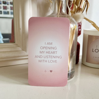 One of the Love Up Love You Affirmation Deck Cards saying "I am opening my heart and listening with love".