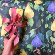 Hand holding gift wrapped parcel