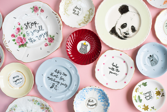 collection of hand painted wall decor plates