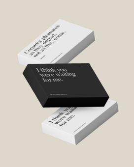 black and white gift boxes with quotes on front of boxes