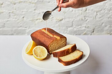 Lemon Drizzle Loaf Cake pouring syrup