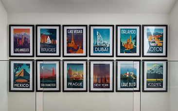 Gallery wall featuring travel poster collection